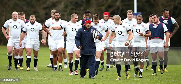 Eddie Jones, the England head coach, leads his team during the England training session held at Pennyhill Park on February 4, 2016 in Bagshot,...