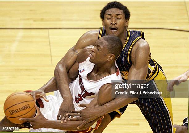 Dwyane Wade of the Miami Heat receives a flagrant foul by Ron Artest of the Indiana Pacers in Game Four of the Eastern Conference Semifinals during...