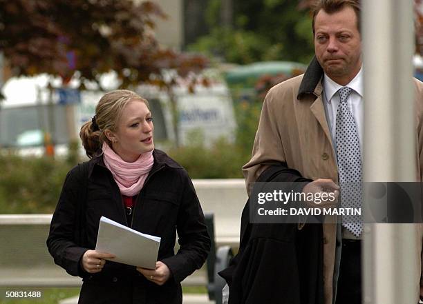 Dutroux' victim Sabine Dardenne and her lawyer Jean-Philippe Riviere arrive at the Arlon assize court, 13 May 2004, for a session of the trial of...