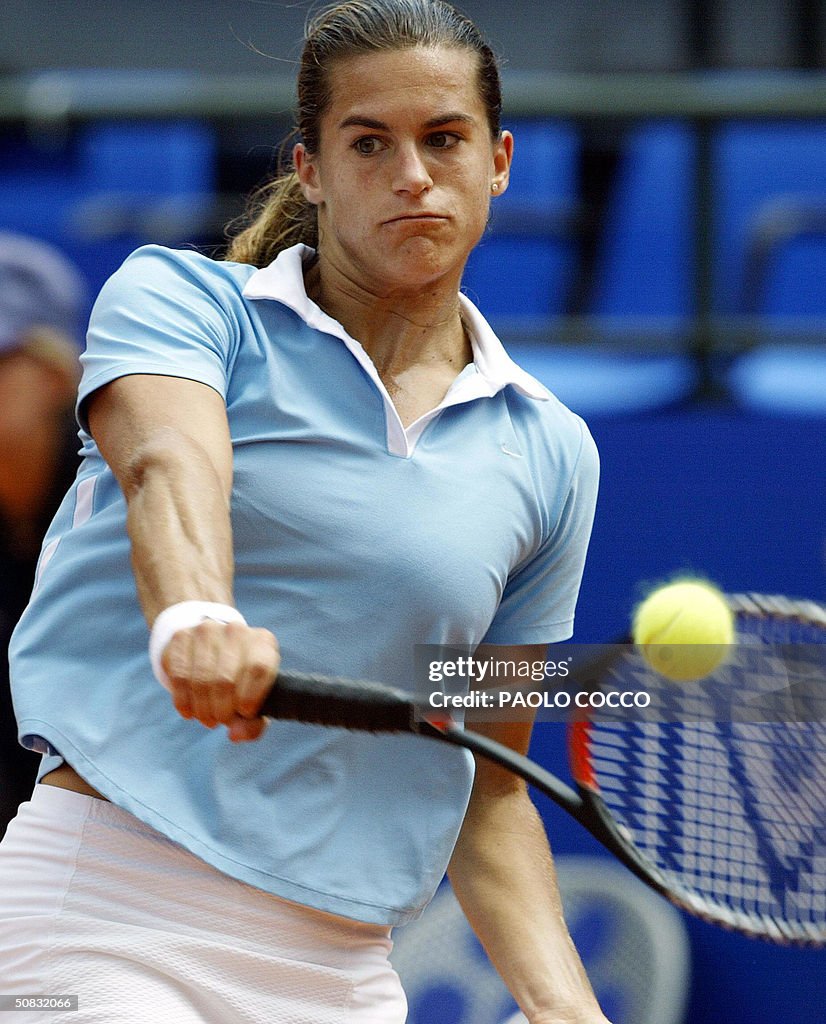 Amelie Mauresmo of France returns a ball