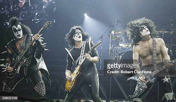 Gene Simmons, Tommy Thayer and Paul Stanley of KISS perform live during the 2004 Rock the Nation World Tour, at the Rod Laver Arena, May 13, 2004 in...