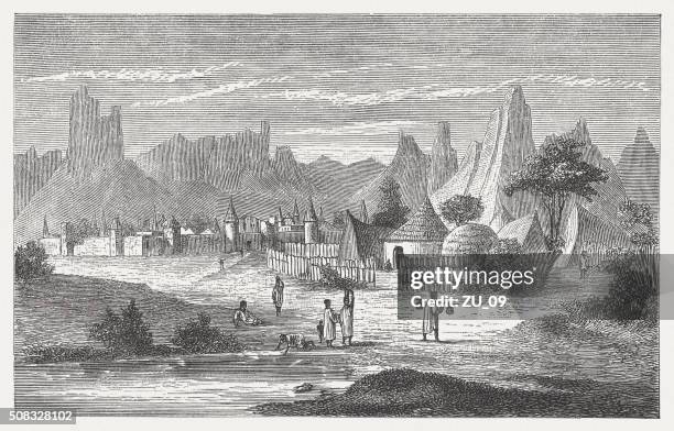 bildbanksillustrationer, clip art samt tecknat material och ikoner med songhai village near hombori, mali, wood engraving, published in 1882 - gao region