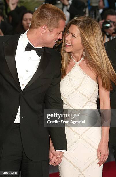 Actor Brad Pitt and wife actress Jennifer Aniston attend the World Premiere of the epic movie "Troy" at Le Palais de Festival on May 13, 2004 in...