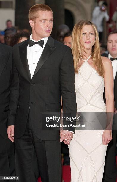 Actor Brad Pitt and wife actress Jennifer Aniston attend the World Premiere of the epic movie "Troy" at Le Palais de Festival on May 13, 2004 in...