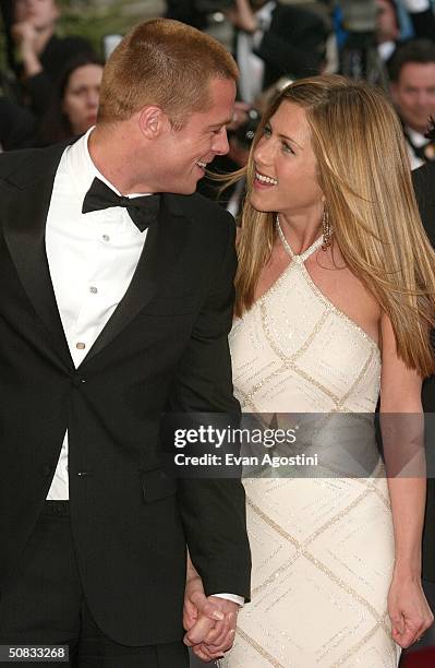 Actor Brad Pitt and wife actress Jennifer Aniston attend the World Premiere of the epic movie "Troy" at Le Palais de Festival on May 13, 2004 in...