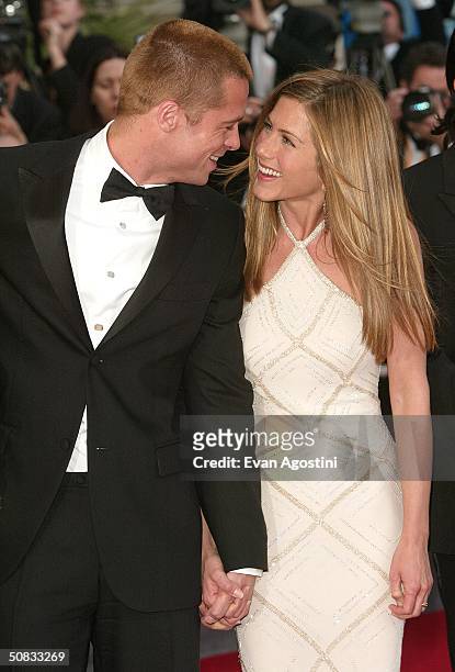 Actor Brad Pitt and wife actress Jennifer Aniston attend the World Premiere of the epic movie "Troy" at Le Palais de Festival on May 13, 2004 in...