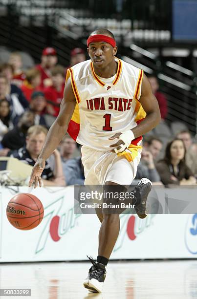 Curtis Stinson of the Iowa State Cyclones brings the ball upcourt during the Phillips 66 Big 12 Tournament game against the Kansas State Wildcats on...