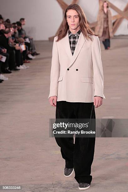 Model walks the runway during the Billy Reid New York Fashion Week Men's Fall/Winter 2016 at Skylight at Clarkson Sq on February 3, 2016 in New York...