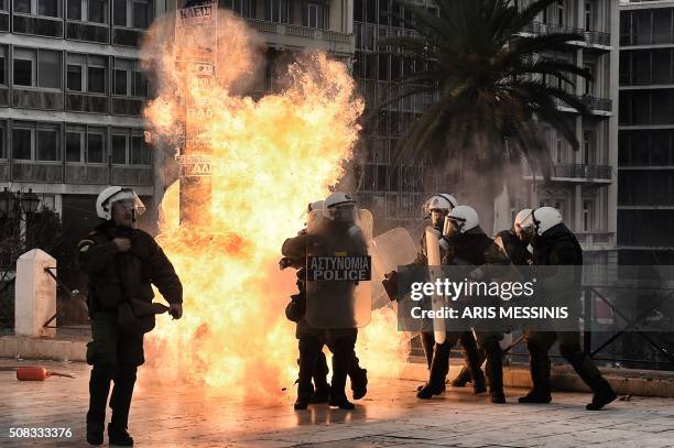 Fire bomb exploses beside police forces trying to protect themselfs from demonstrators throwing stones and petrol bombs towards them during a massive...