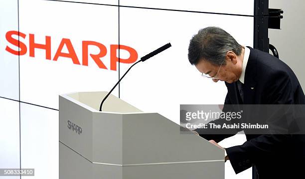 Sharp President Kozo Takahashi bows at the start of a press conference announcing the financial result of first to third quarters of fiscal 2015 on...