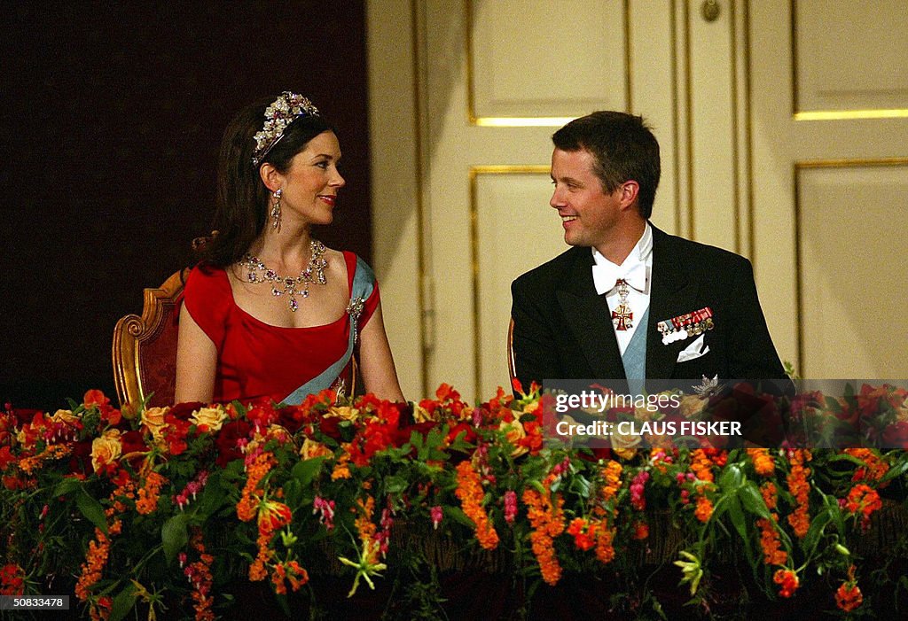 Danish Crown Prince Frederik looks at hi