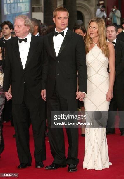 Director Wolfgang Petersen, actor Brad Pitt and his wife actress Jennifer Aniston attend the World Premiere of the epic movie "Troy" at Le Palais de...