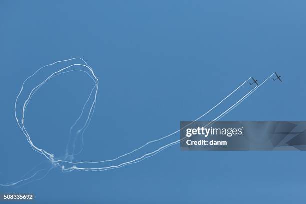 aviatic air show with smoke and blue sky - acrobat net stock pictures, royalty-free photos & images