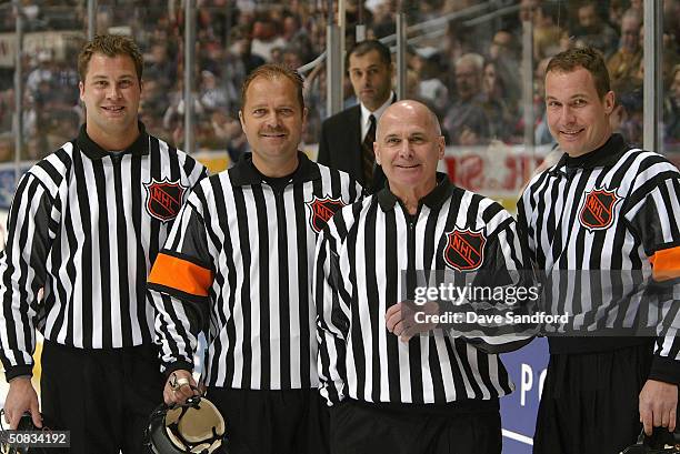 Officials Mark Shewchyk, Dan O'Halloran#13, Ray Scapinello and Stephen Walkom pose for a group photo prior to the game between the Tampa Bay...