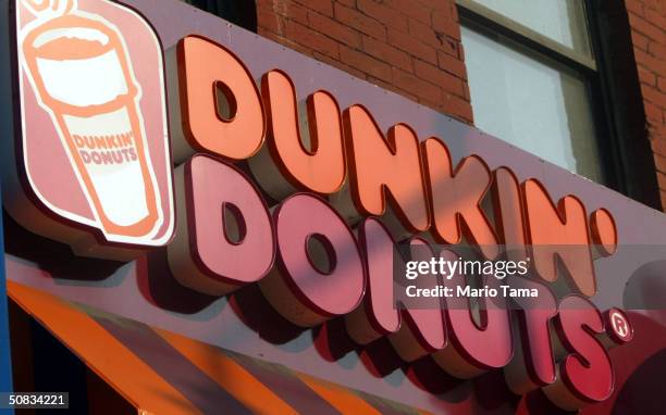 Dunkin Donuts sign is seen May 13, 2004 in New York City. Dunkin Donuts plans to open 10 stores inside Wal-Mart stores within the next three months.