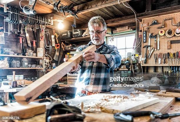 senior craftsman working in traditional workshop - shed stock pictures, royalty-free photos & images