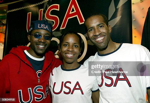 Members of the U.S. Olympic Fencing team Ivan Lee, Erinn Smart and her brother Keeth Smart pose for a photo during unveiling of the 2004 U.S. Olympic...