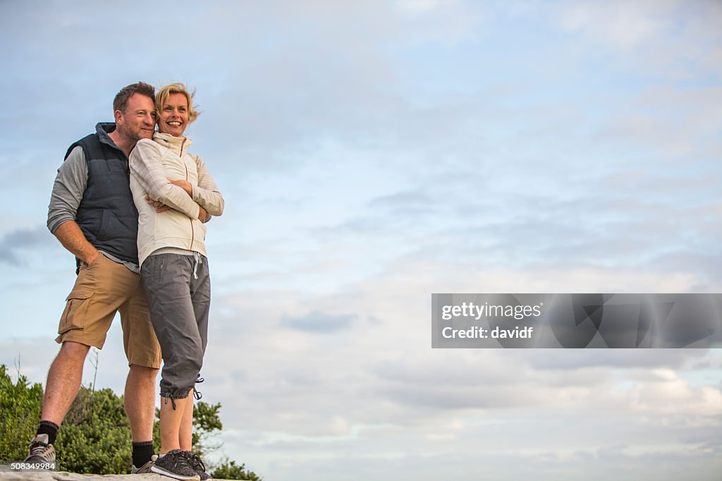 Happy Hugging Middle Aged Active Fit Healthy Beach Couple Outdoors