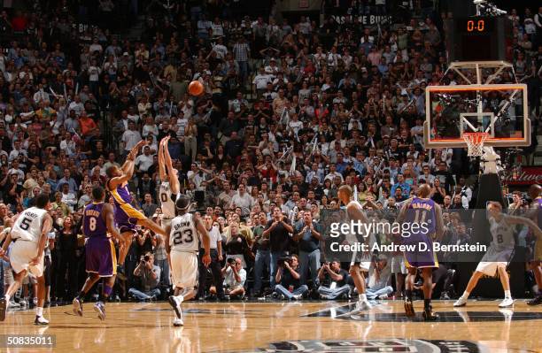 Derek Fisher of the Los Angeles Lakers shoots and makes the game-winning shot over Emanuel Ginobili of the San Antonio Spurs at the buzzer in Game...