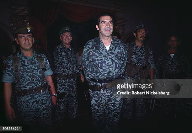 Guatemalan President and Army General Efraim Rios Montt stands with army soldiers during a press conference at the Presidential Palace to announce...