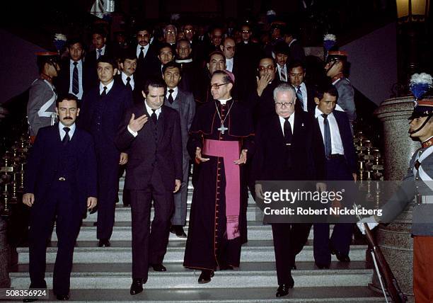 Guatemalan President and Army General Efraim Rios Montt speaks to an unidentified Roman Catholic cardinal as they descend a marble staircase,...