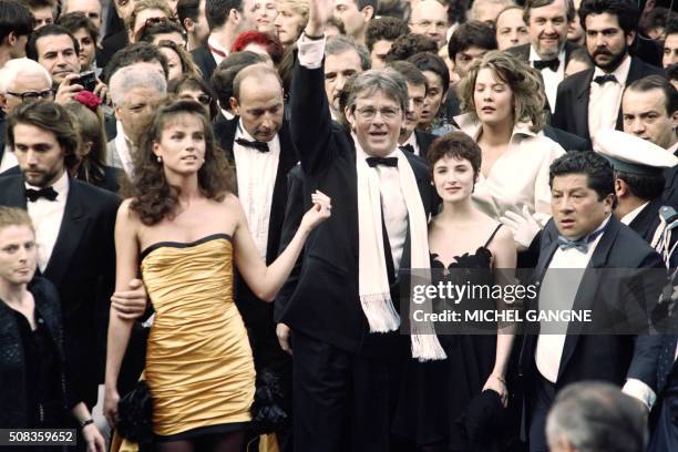 French actor Alain Delon , his film partner Elsa and his Dutch model companion Rosalie Van Breemen arrive on May 8, 1992 at the Cannes Film Festival...