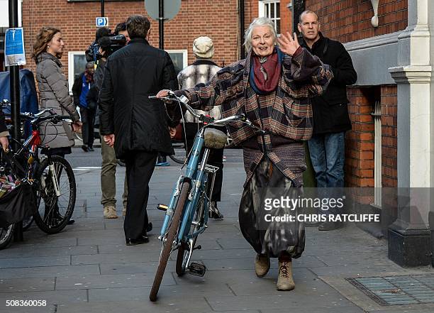 British fashion designer and activist Vivienne Westwood pushes her bicycle as she leaves the Ecuadorian embassy, in central London on February 4...