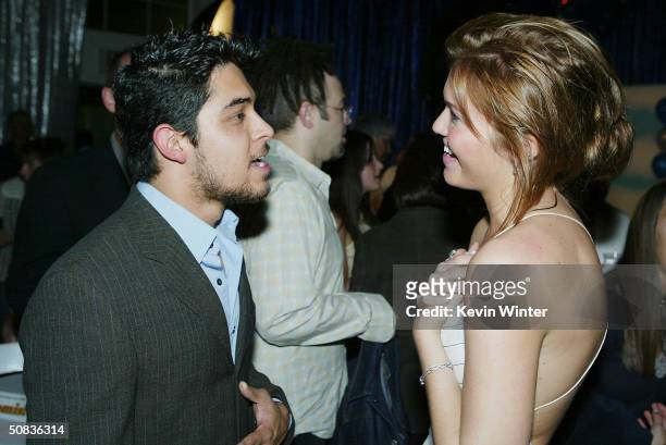 Actors Wilmer Valderrama and Mandy Moore talk at the after-party for United Artists' "Saved" at the Beverly Hills Community Sports Center on May 13,...