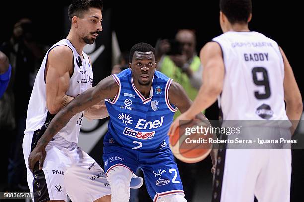 Durand Scott of Enel competes with Valerio Mazzola and Abdul Gaddy of Obiettivo Lavoro during the LegaBasket match between Virtus Obiettivo Lavoro...