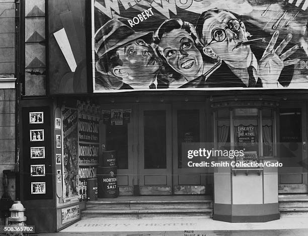 Exterior view of the Liberty Theater, showing The Rainmakers, New Orleans, Louisiana, 1935. From the New York Public Library. .