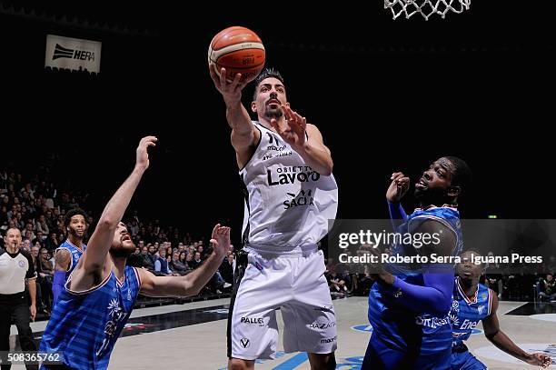 Valerio Mazzola of Obiettivo Lavoro competes with Andrea Zerini and Oderah Anosike of Enel during the LegaBasket match between Virtus Obiettivo...