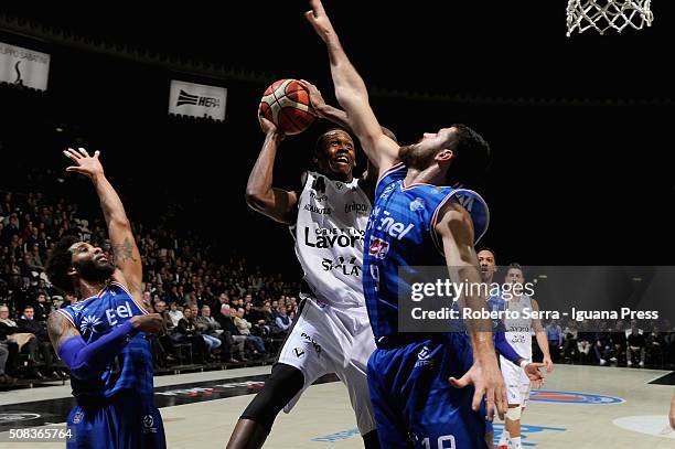 Rod Odom of Obiettivo Lavoro competes with Adrian Banks and Andrea Zerini of Enel during the LegaBasket match between Virtus Obiettivo Lavoro and...