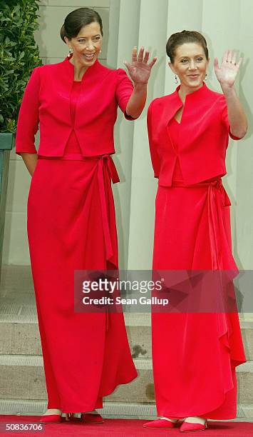 Miss Mary Elizabeth Donaldson's bridesmaids, Jane Alison Stephens and Patricia Anne Bailey wait for their sister to arrive at Copenhagen Cathedral on...