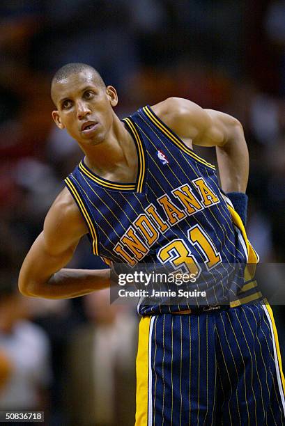 Reggie Miller of the Indiana Pacers leans over in Game three of the Eastern Conference Semifinals during the 2004 Playoffs against the Miami Heat at...