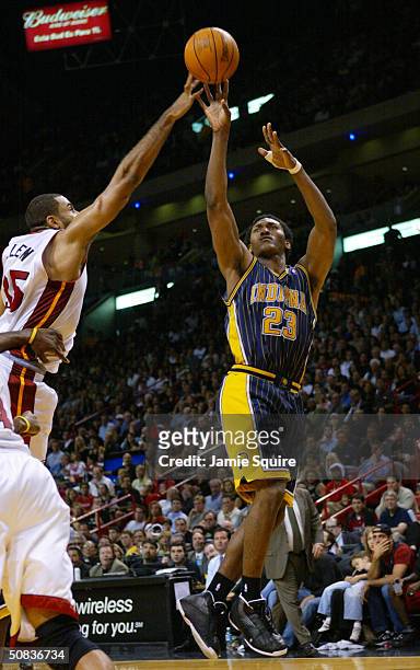 Ron Artest of the Indiana Pacers shoots over Malik Allen of the Miami Heat in Game three of the Eastern Conference Semifinals during the 2004...