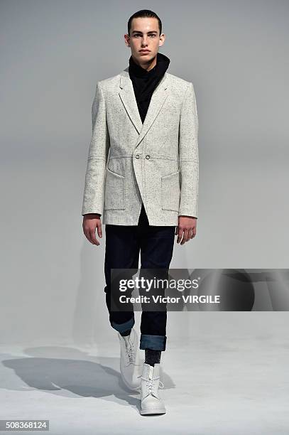 Model poses for photos during the Edmund Ooi Presentation during New York Fashion Week Men's Fall/Winter 2016 on February 1, 2016 in New York City.