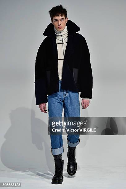 Model poses for photos during the Edmund Ooi Presentation during New York Fashion Week Men's Fall/Winter 2016 on February 1, 2016 in New York City.