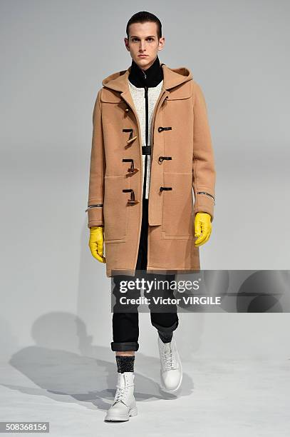 Model poses for photos during the Edmund Ooi Presentation during New York Fashion Week Men's Fall/Winter 2016 on February 1, 2016 in New York City.