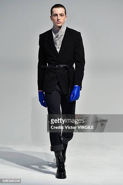 Model poses for photos during the Edmund Ooi Presentation during New York Fashion Week Men's Fall/Winter 2016 on February 1, 2016 in New York City.