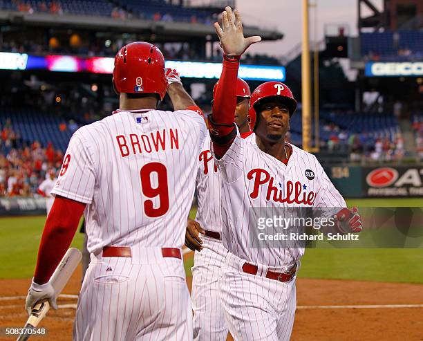 Darnell Sweeney of the Philadelphia Phillies is congratulated by teammate Domonic Brown after he hit a two run home run against the San Diego Padres...