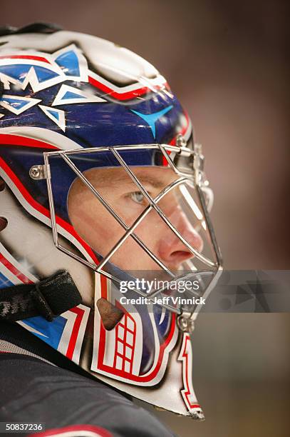 Johan Hedberg of the Vancouver Canucks looks on during the game against the Calgary Flames in the first round of the 2004 NHL Stanley Cup Playoffs at...