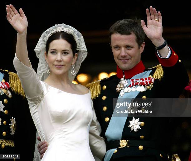 Crown Princess Mary and Crown Prince Frederik of Denmark wave from the balcony of Christian VII's Palace after their wedding on May 14, 2004 in...