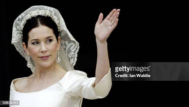 Crown Princess Mary waves from the balcony of Christian VII's Palace after her wedding to Crown Prince Frederik of Denmark on May 14, 2004 in...
