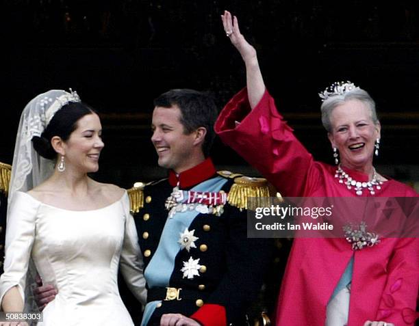 Crown Princess Mary and Crown Prince Frederik share a laugh as Queen Margrethe II of Denmark waves to the crowd as the Royal couple appear on the...