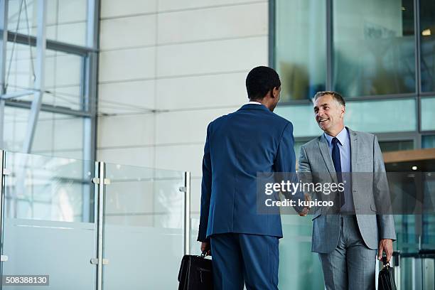 i know you'll be a great addition to the company - business people handshake stockfoto's en -beelden