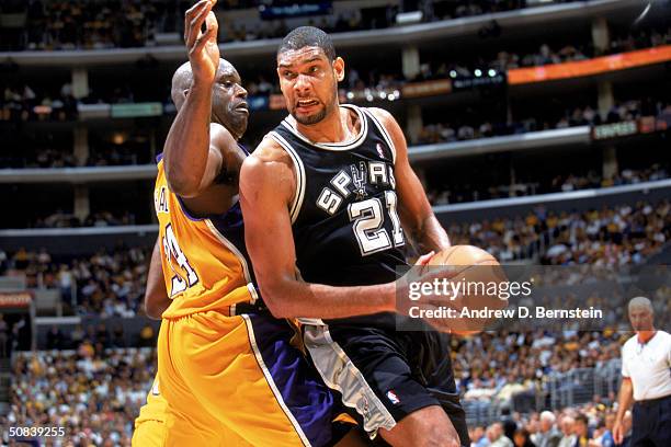 Tim Duncan of the San Antonio Spurs is defended by Shaquille O'Neal of the Los Angeles Lakers in Game Four of the Western Conference Semifinals...