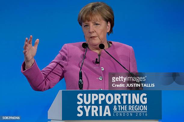 German Chancellor Angela Merkel addresses a press conference at the QEII centre in central London on February 4 towards the end of a donors'...