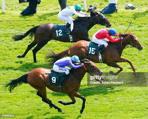 Kieren Fallon and Russian Rhythm get the better of the Richard Quinn ridden Norse Dacer to land The Juddmonte Lockinge Stakes Race run at Newbury...