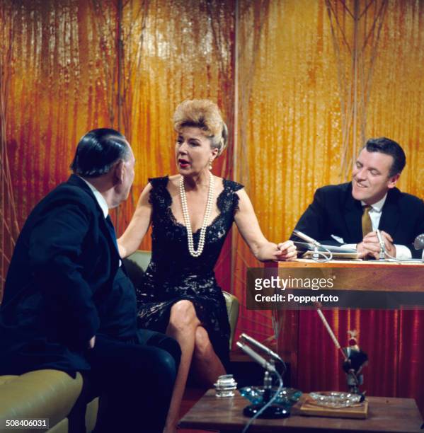 American entertainer Gypsy Rose Lee appears with trade unionist Ted Hill and chat show host Eamonn Andrews on the set of the television series 'The...