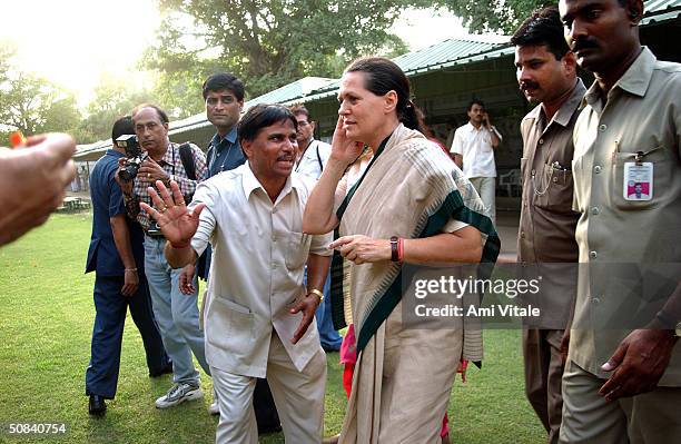 Sonia Gandhi walks over to supporters after being elected Congress Party leader May 15, 2004 in New Delhi, India. Congress' election of Ghandi as its...